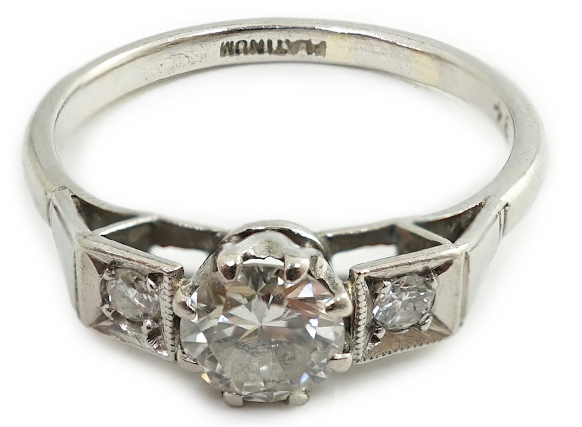 A 1920's/1930's platinum and single stone diamond set ring, with two stone diamond set shoulders